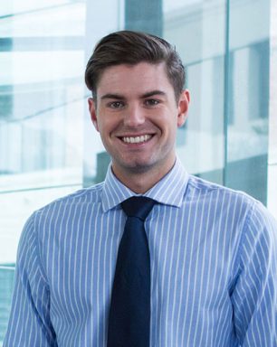 a man in a blue shirt and tie.