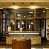 a lobby with a checkered floor and a large window.